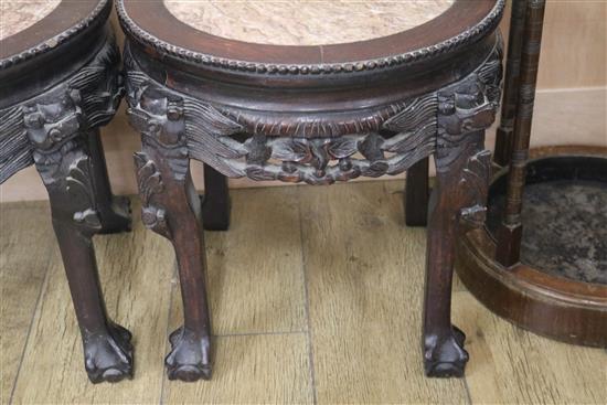 A pair of Chinese hardwood and marble stands H.47cm